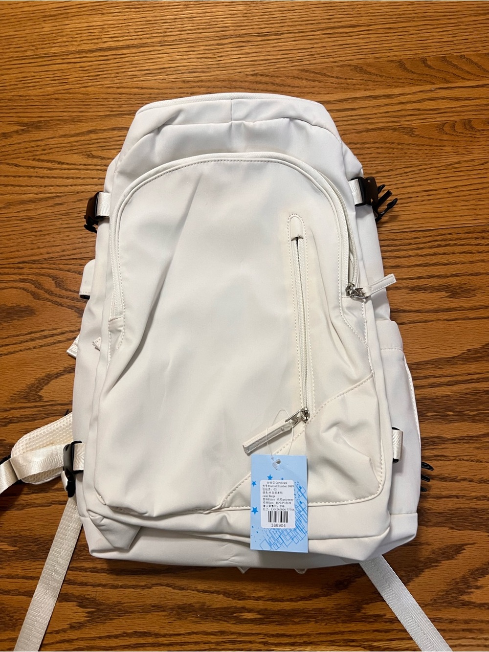 Off White Everyday Backpack with Front Zip Pocket!  Lots of pockets!